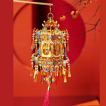 Completed palace lantern hanging against a red background