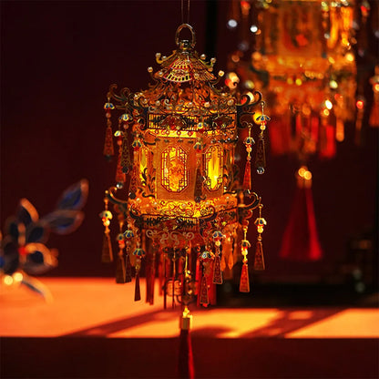 Completed palace lantern glowing in a dark, warmly lit setting